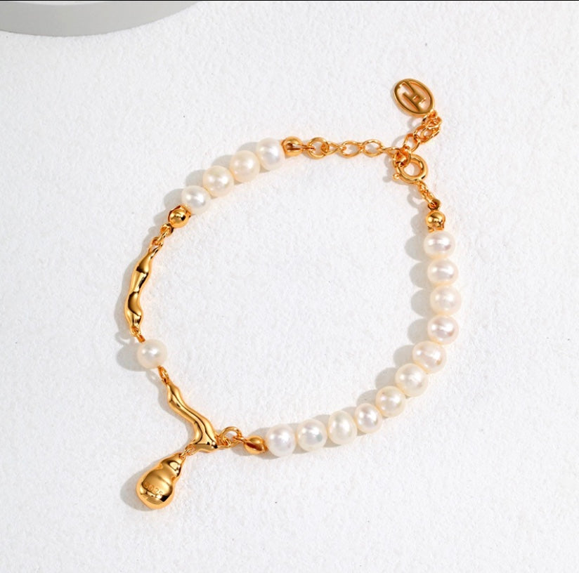 Elegance: Golden Drop Pearl Bracelet