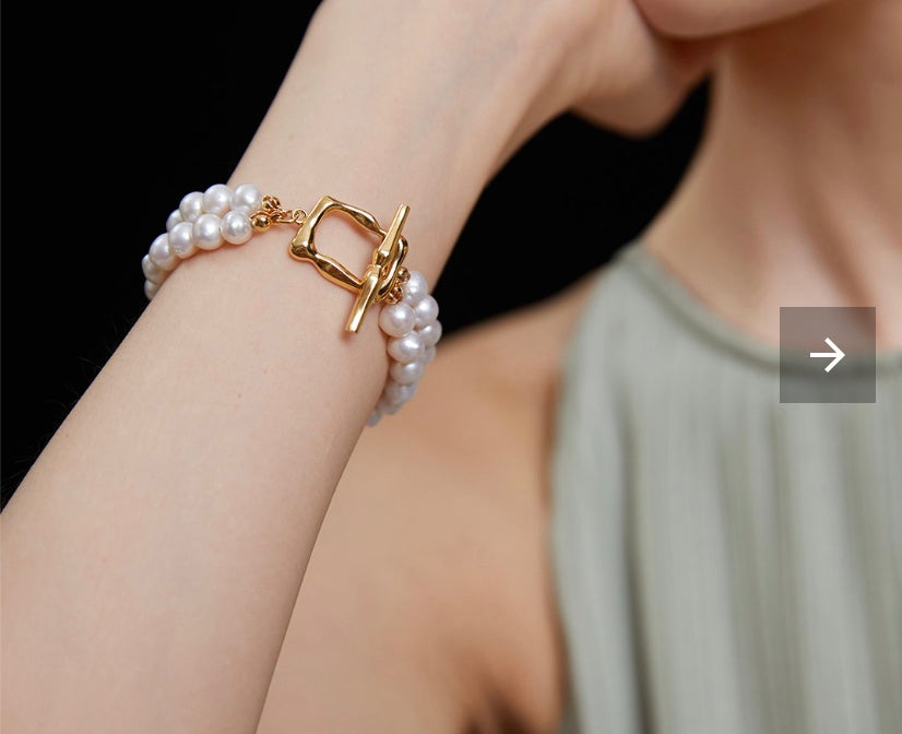 Wealth: Lustrous Double-Strand Pearl Bracelet with Gold Clasp