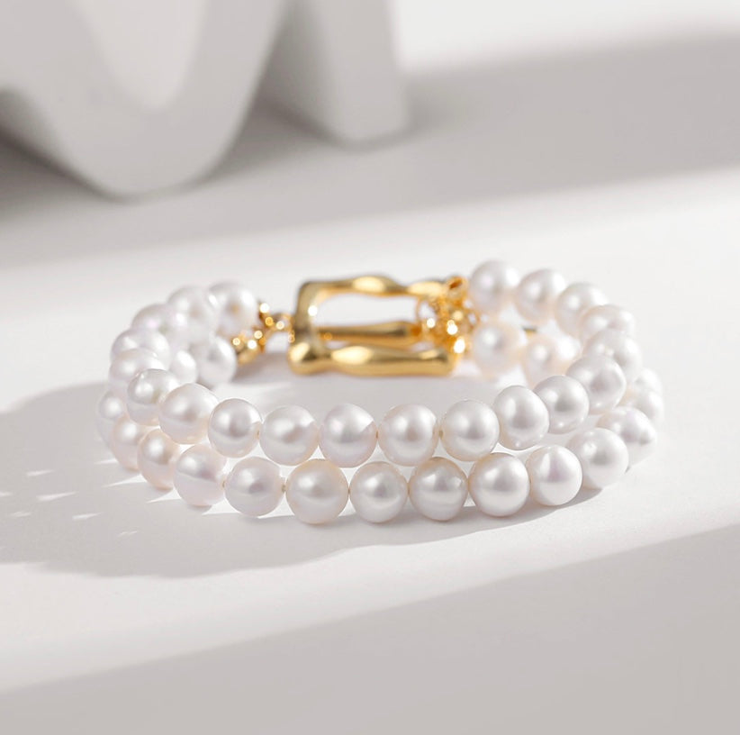 Wealth: Lustrous Double-Strand Pearl Bracelet with Gold Clasp
