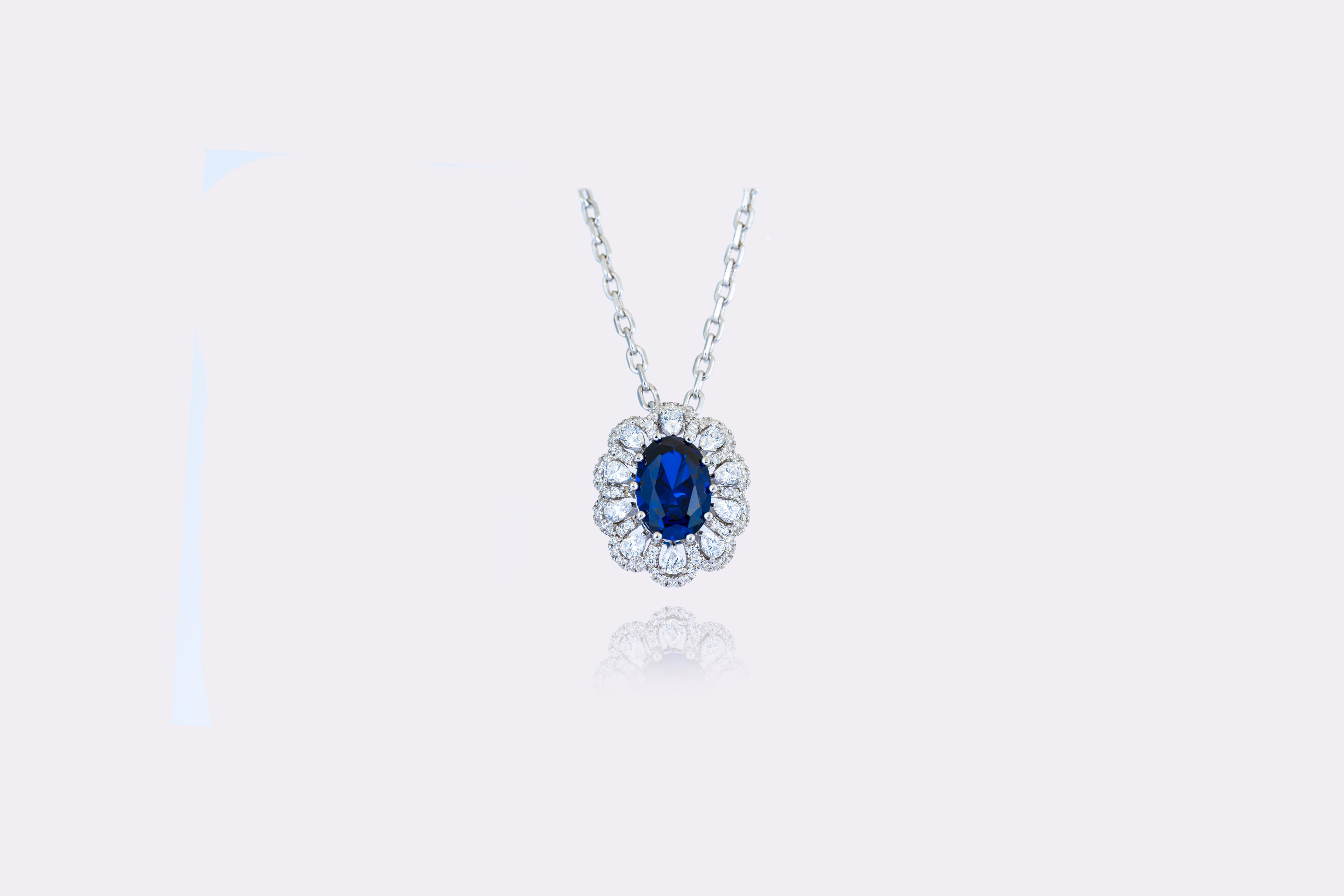 Sapphire Splendor: Regal Blue Sapphire and Diamond Pendant in Sterling Silver