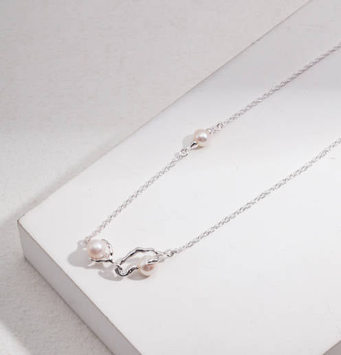 Nestled Elegance: Sterling Silver Pearl Necklace